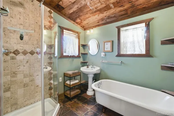 a bathroom with a sink a toilet and a bathtub