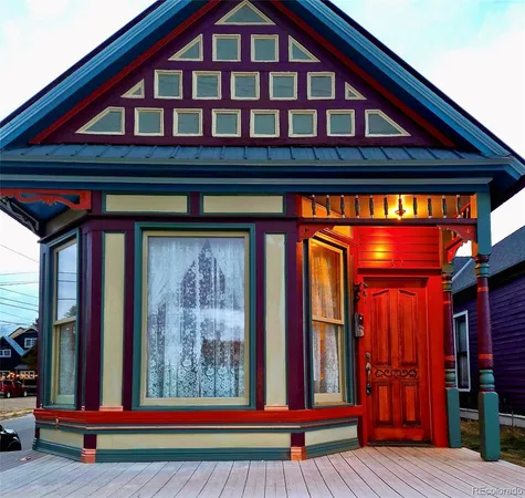 a view of wooden door with a red door