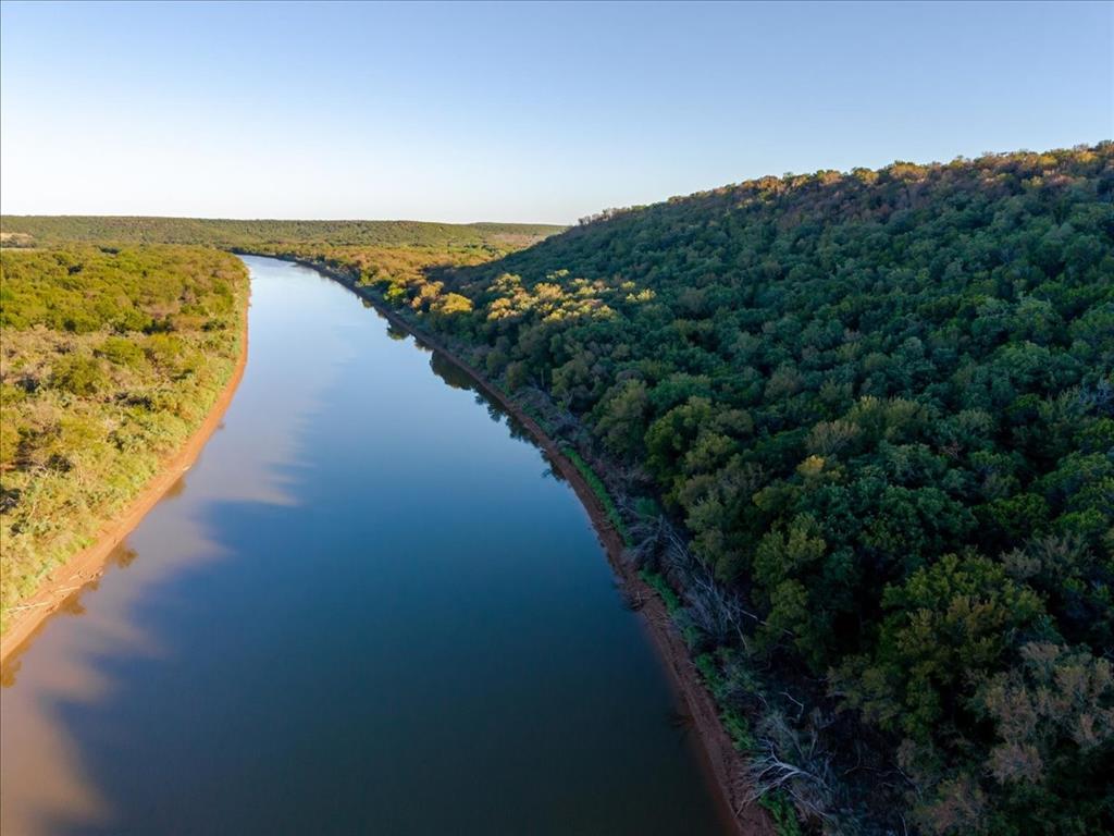 1674 Ming Bend Road Graham, TX 76450 - Photo 25 of 40 Riverfront property featuring a clear waterway and extensive tree coverage