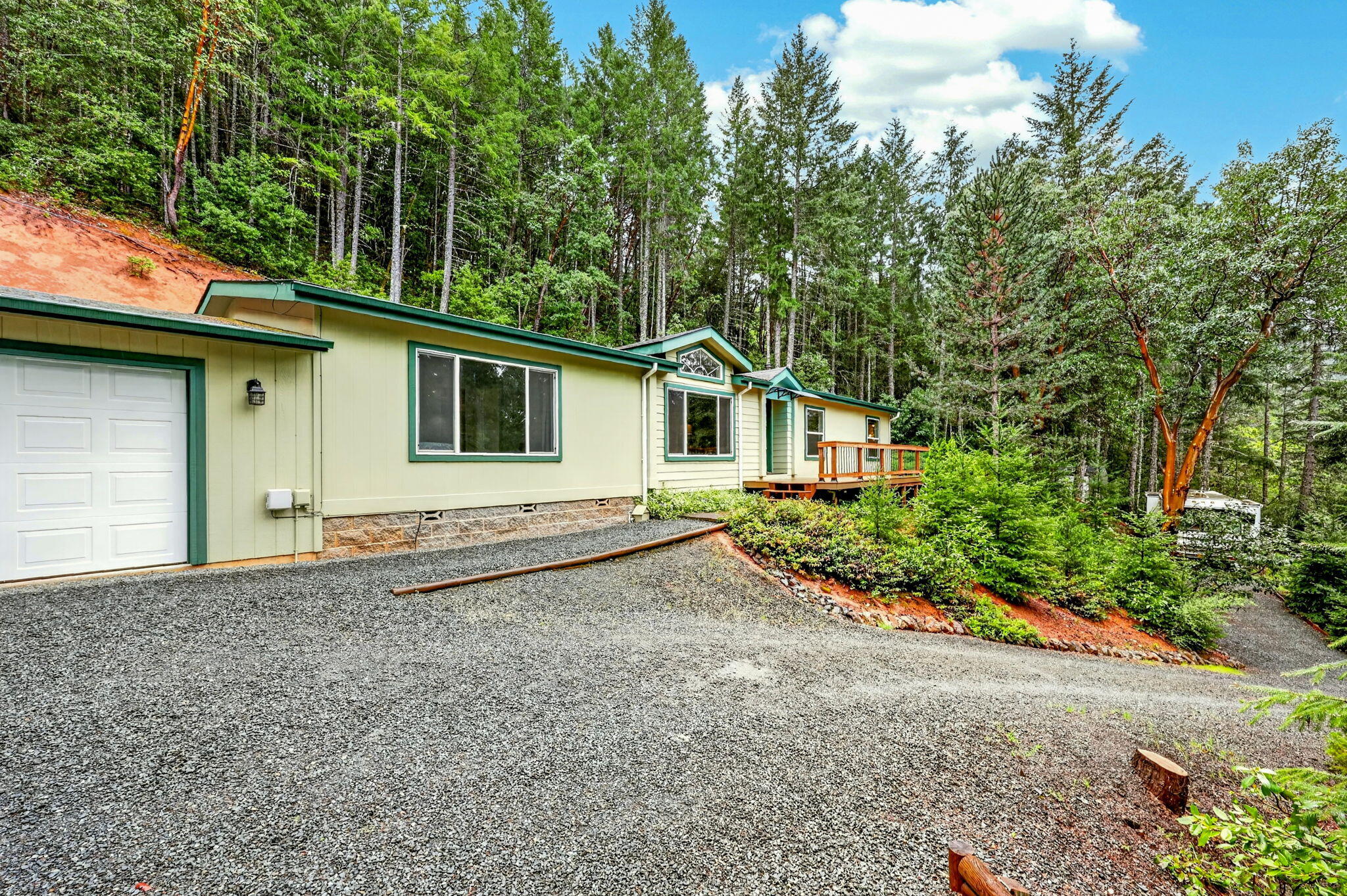 5445 Thompson Creek Road Selma, OR 97538 - Photo 42 of 57 a house with trees in the background