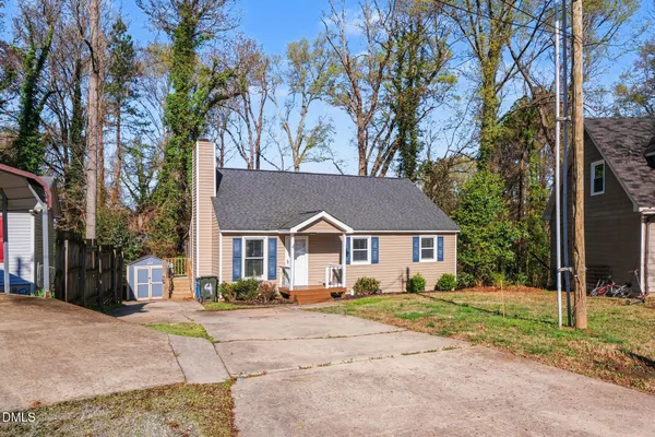 front view of a house next to a yard