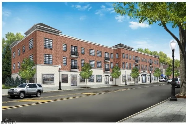 a view of building with car parked on the road