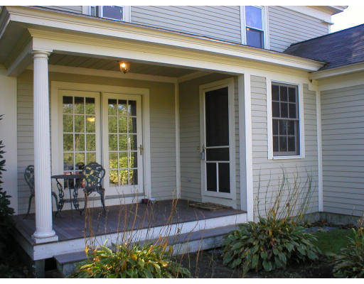 320 Still River Road Harvard, MA 01451 - Photo 11 of 14 a front view of house with outdoor seating and stairs