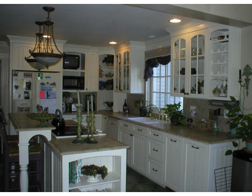 320 Still River Road Harvard, MA 01451 - Photo 3 of 14 a kitchen with cabinets and window