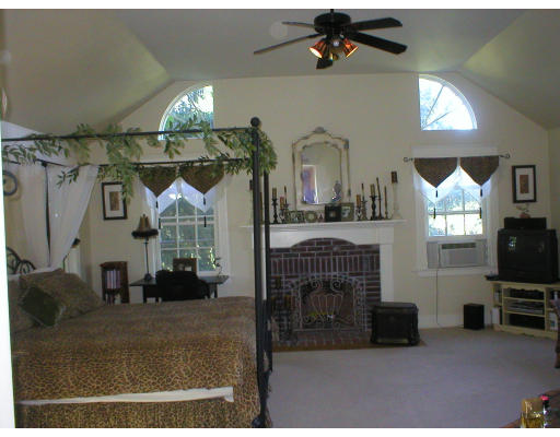 320 Still River Road Harvard, MA 01451 - Photo 4 of 14 a view of a livingroom with furniture and a flat screen tv