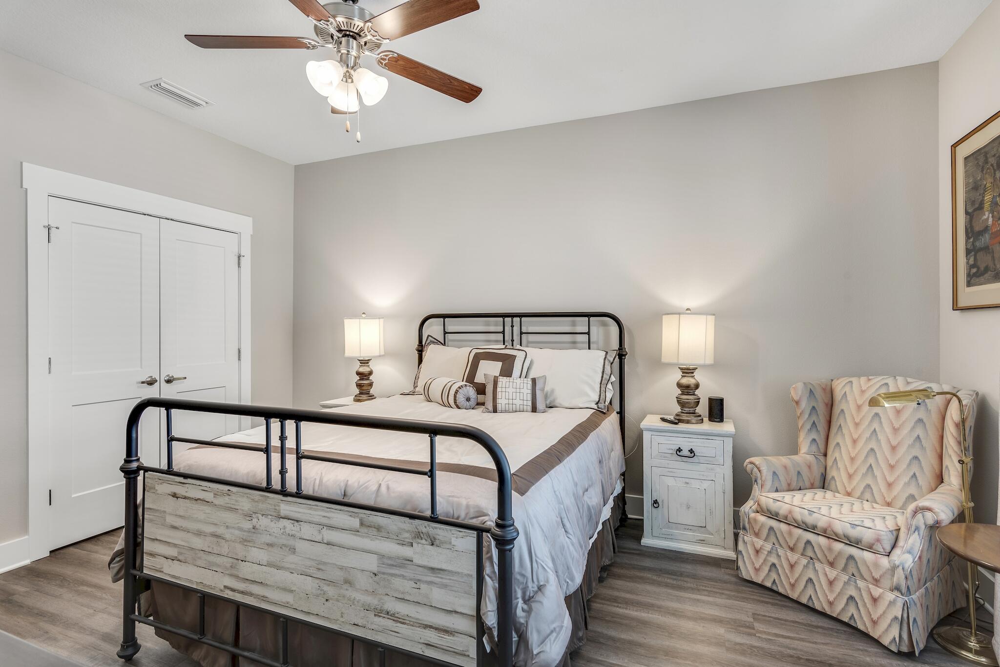 157 North Sand Palm Road Freeport, FL 32439 - Photo 14 of 24 a bedroom with a bed and a couch