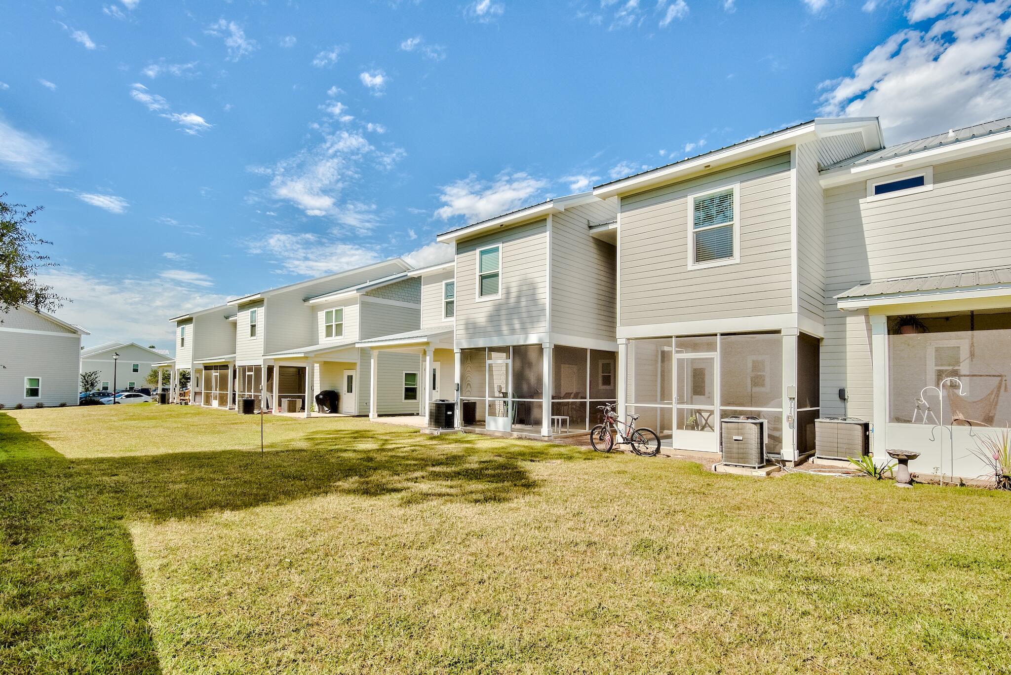 157 North Sand Palm Road Freeport, FL 32439 - Photo 23 of 24 a front view of building with yard