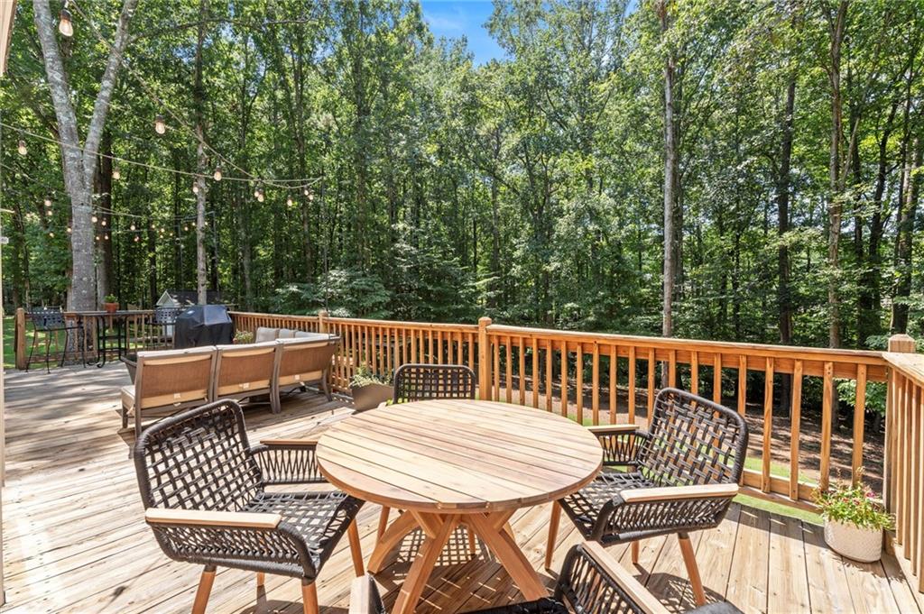 313 Thorntree Lane Canton, GA 30115 - Photo 19 of 51 a view of a chairs and table on the deck