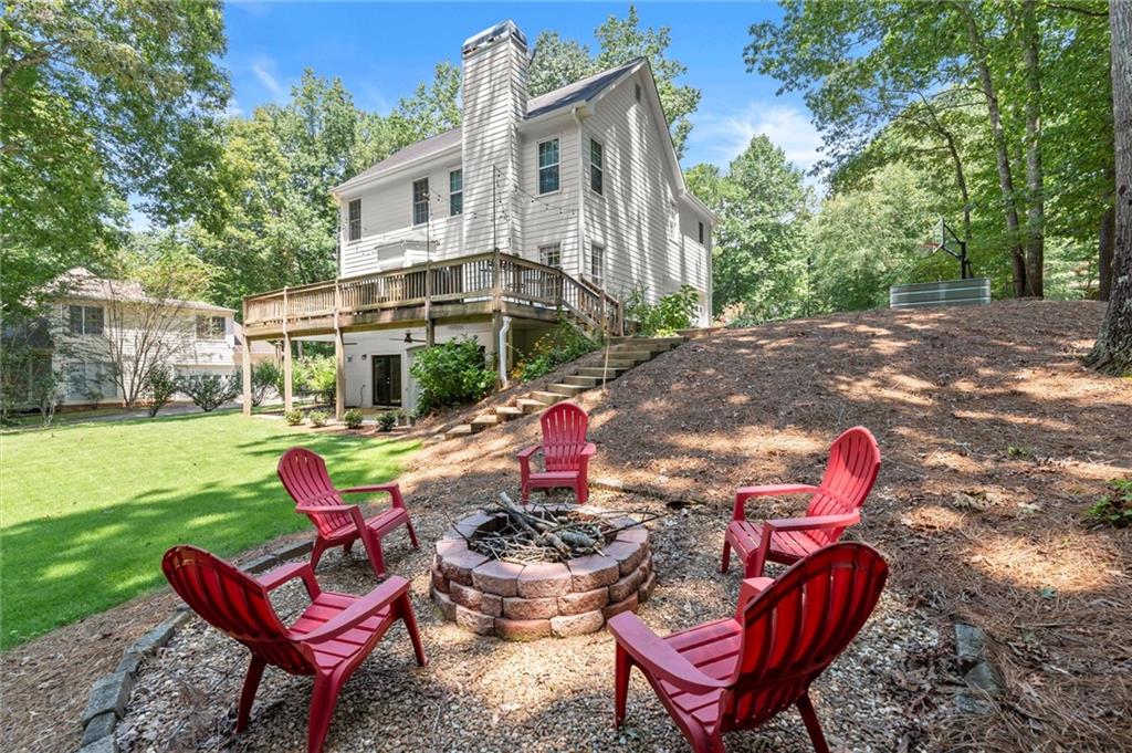 313 Thorntree Lane Canton, GA 30115 - Photo 2 of 51 a backyard of a house with outdoor seating