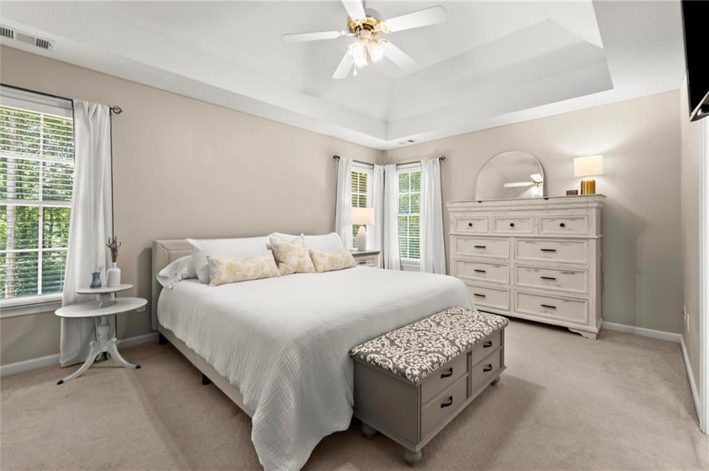 313 Thorntree Lane Canton, GA 30115 - Photo 21 of 51 a bedroom with a bed and a dresser