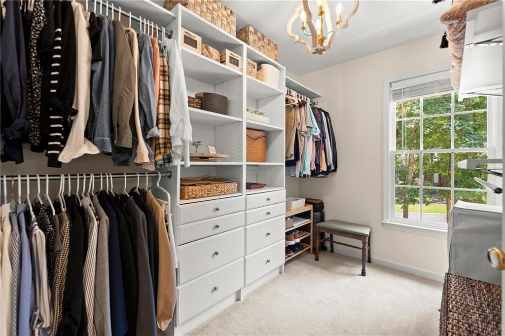 313 Thorntree Lane Canton, GA 30115 - Photo 27 of 51 a view of walk in closet with clothes and shoes