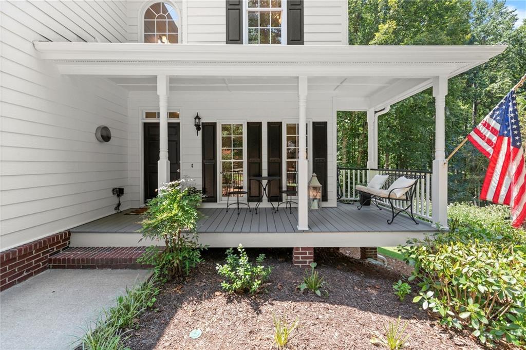 313 Thorntree Lane Canton, GA 30115 - Photo 3 of 51 a view of house with backyard and outdoor seating