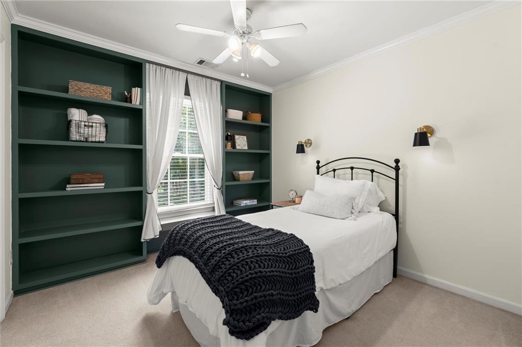 313 Thorntree Lane Canton, GA 30115 - Photo 33 of 51 a bedroom with a bed a window and closet