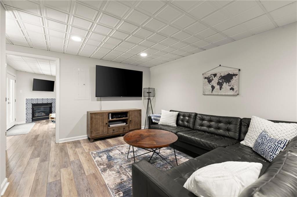 313 Thorntree Lane Canton, GA 30115 - Photo 40 of 51 a living room with furniture and a flat screen tv