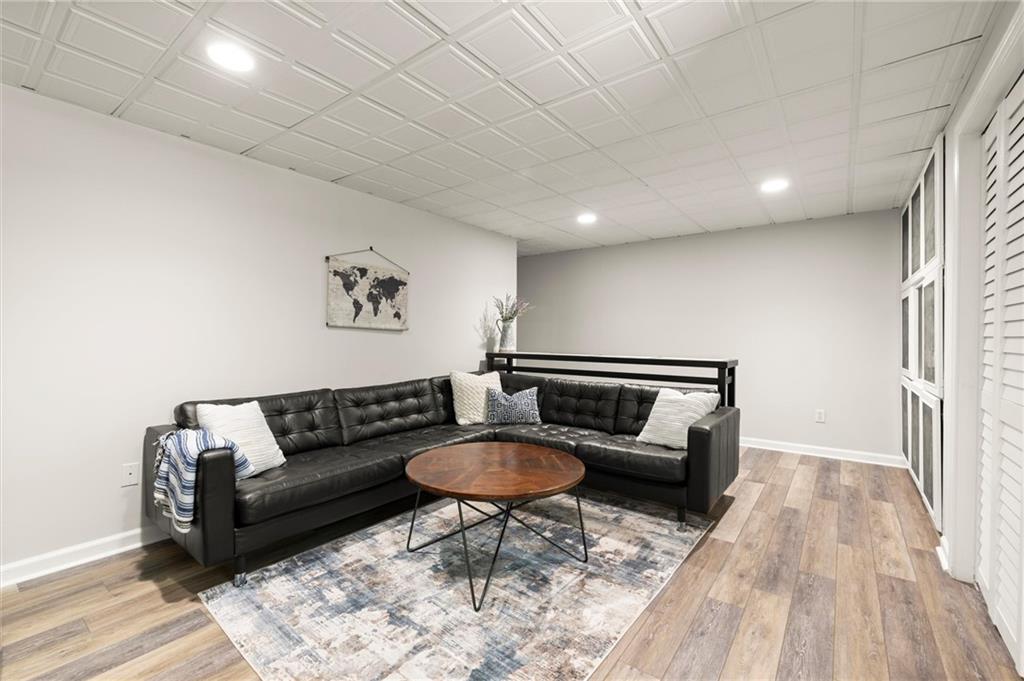 313 Thorntree Lane Canton, GA 30115 - Photo 41 of 51 a living room with furniture and a wooden floor