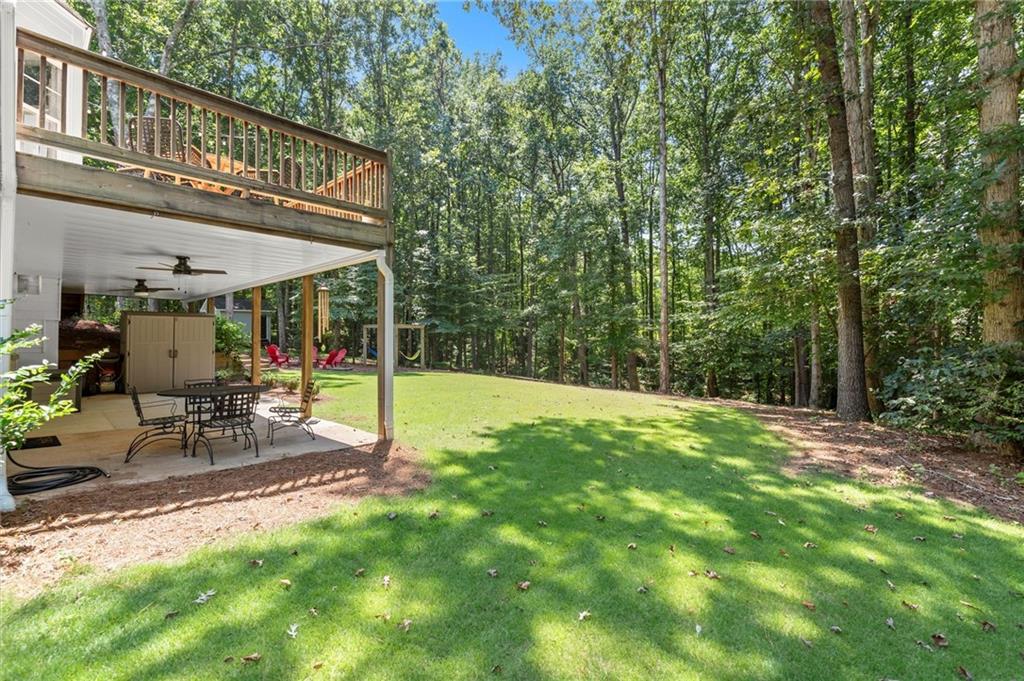 313 Thorntree Lane Canton, GA 30115 - Photo 47 of 51 a view of a chair and table in backyard of the house