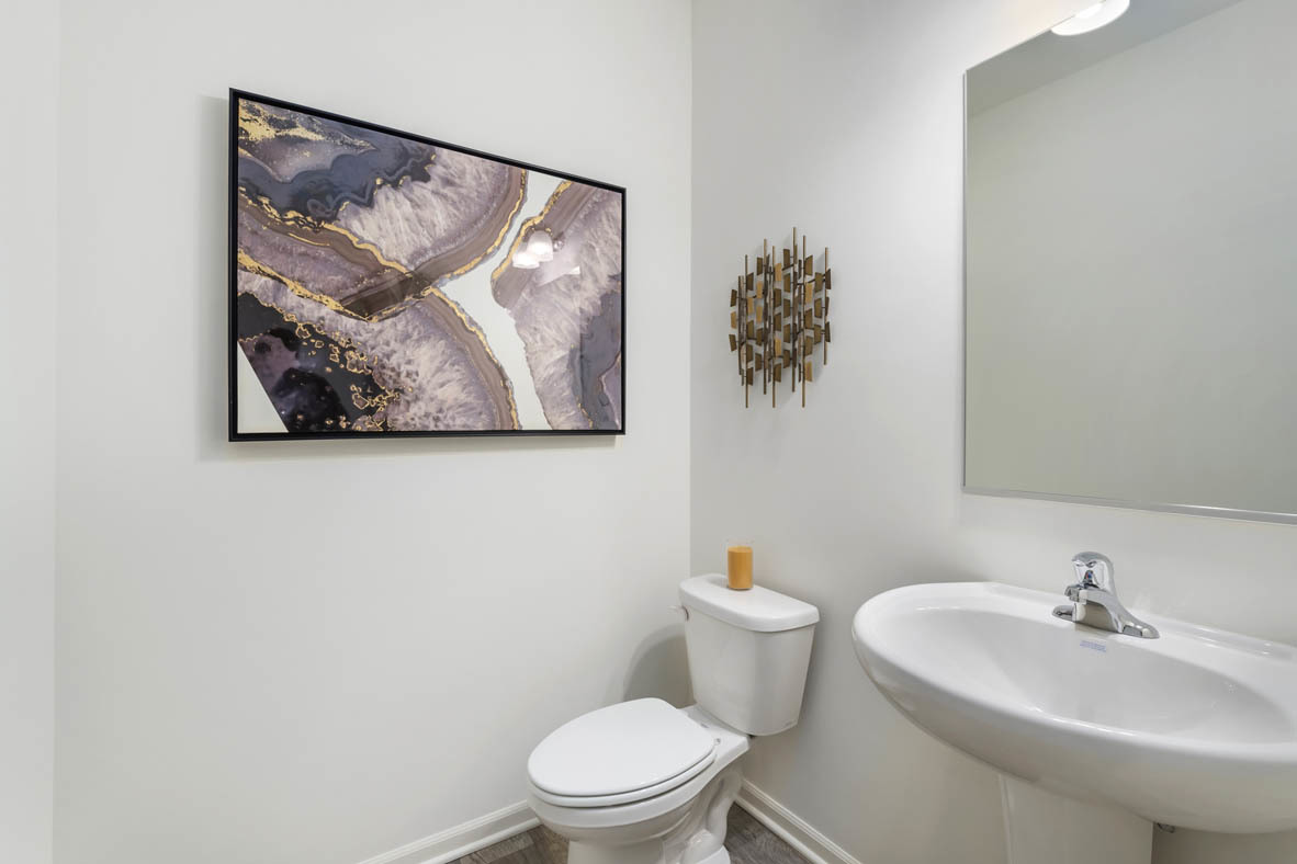 Undisclosed Address Elgin, IL 60124 - Photo 11 of 19 a bathroom with a toilet a sink and mirror