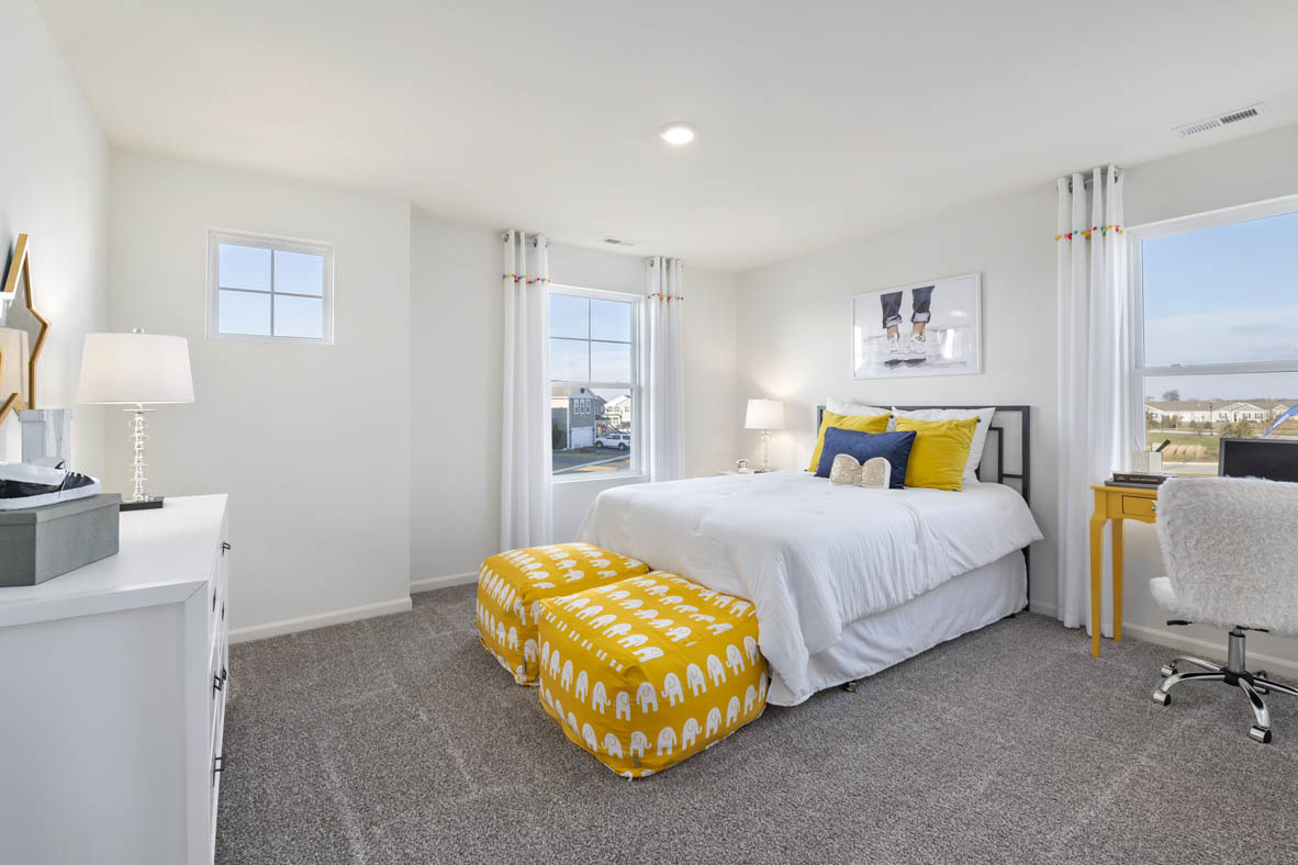 Undisclosed Address Elgin, IL 60124 - Photo 12 of 19 a spacious bedroom with a bed and a couch