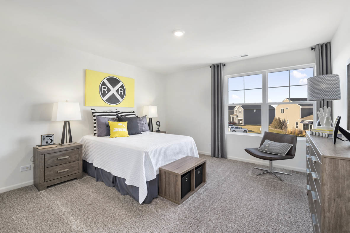 Undisclosed Address Elgin, IL 60124 - Photo 14 of 19 a bedroom with a bed a couch and dresser