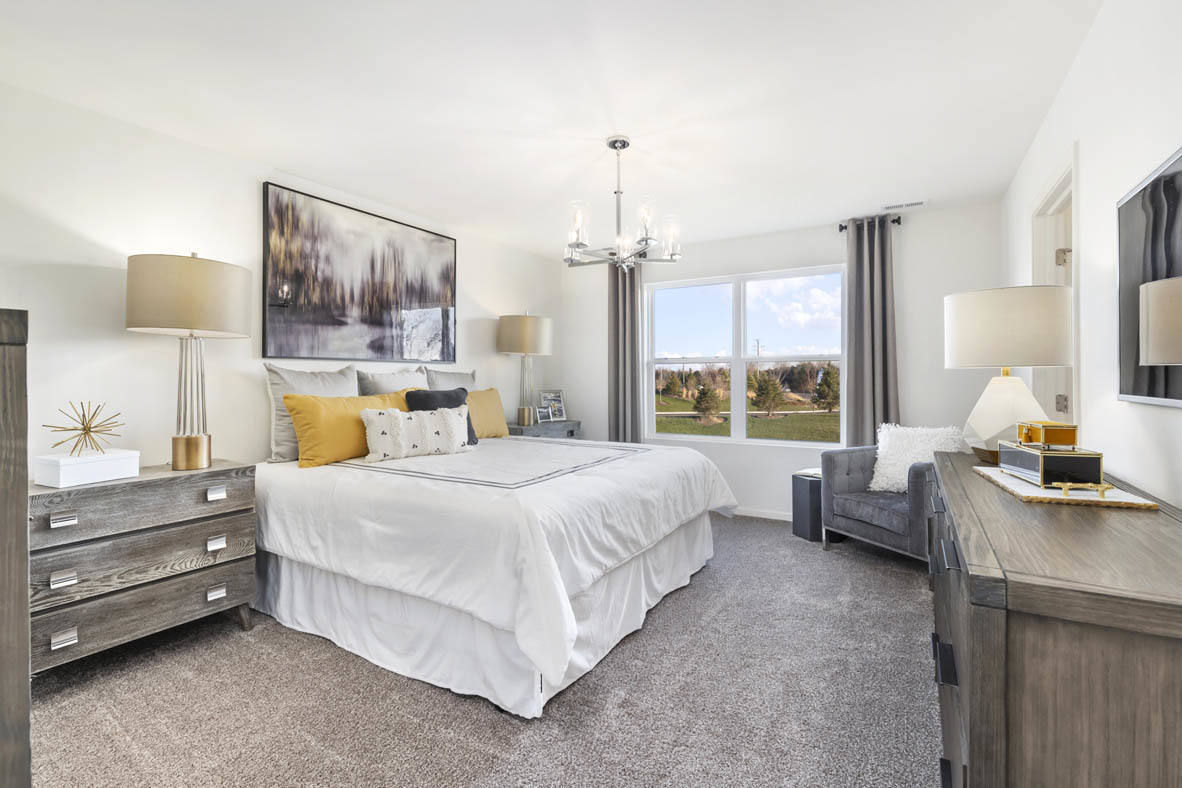 Undisclosed Address Elgin, IL 60124 - Photo 16 of 19 a bedroom with a bed and window