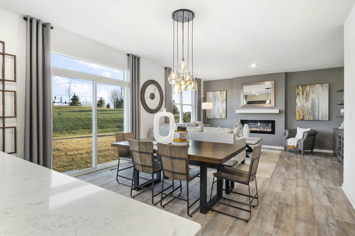 Undisclosed Address Elgin, IL 60124 - Photo 7 of 19 a dining room with furniture a clock and a large window