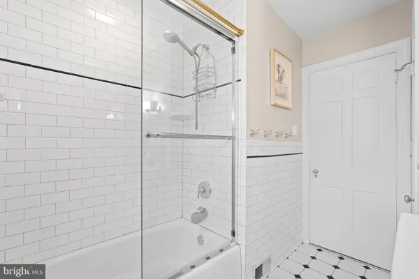 a bathroom with a bathtub and shower