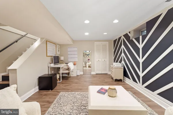 a living room with furniture and a rug