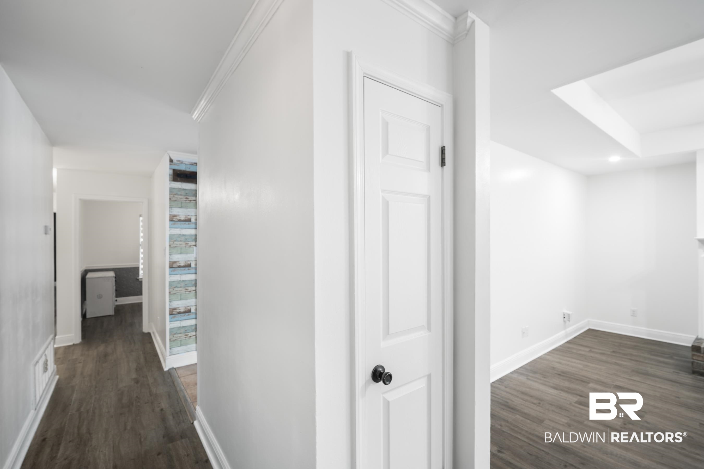 3101 Autumn Ridge Drive West Mobile, AL 36695 - Photo 11 of 36 Corridor featuring dark wood finished floors and baseboards