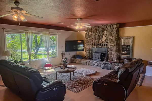 a kitchen with stainless steel appliances a stove a sink dishwasher and a refrigerator
