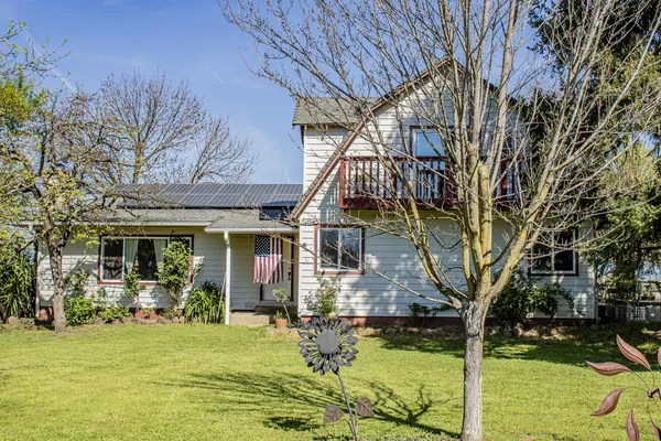 a front view of house with yard