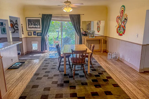 a kitchen with stainless steel appliances a stove a sink and cabinets