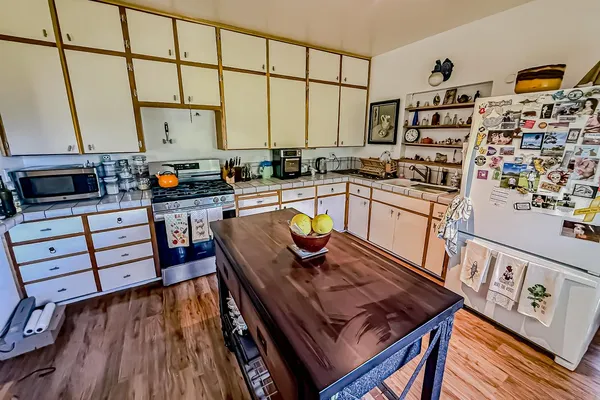 a bathroom with a sink mirror vanity and toilet