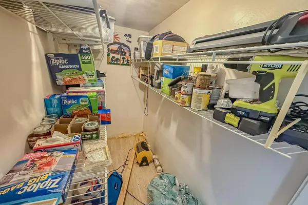 a bedroom with a large bed and a couch