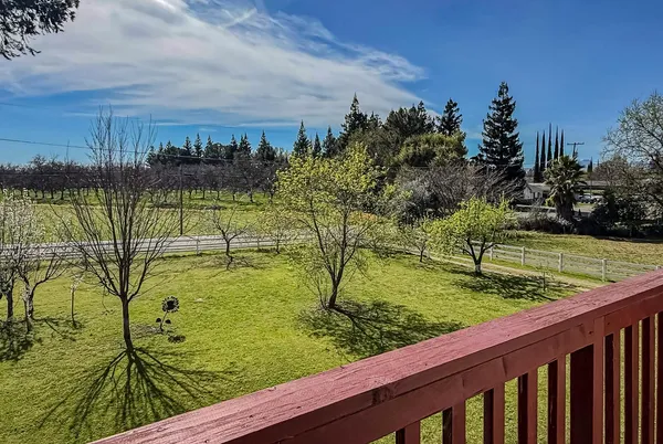 a lake view with a big yard