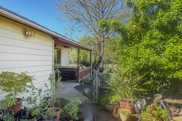 a view of a chairs and table in the yard
