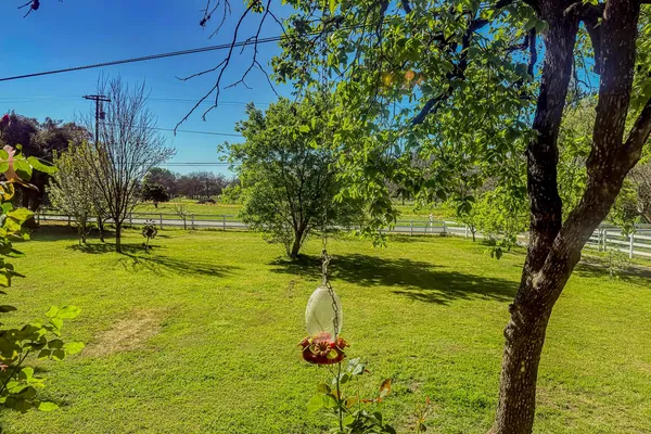 a view of yard with swimming pool and outdoor seating