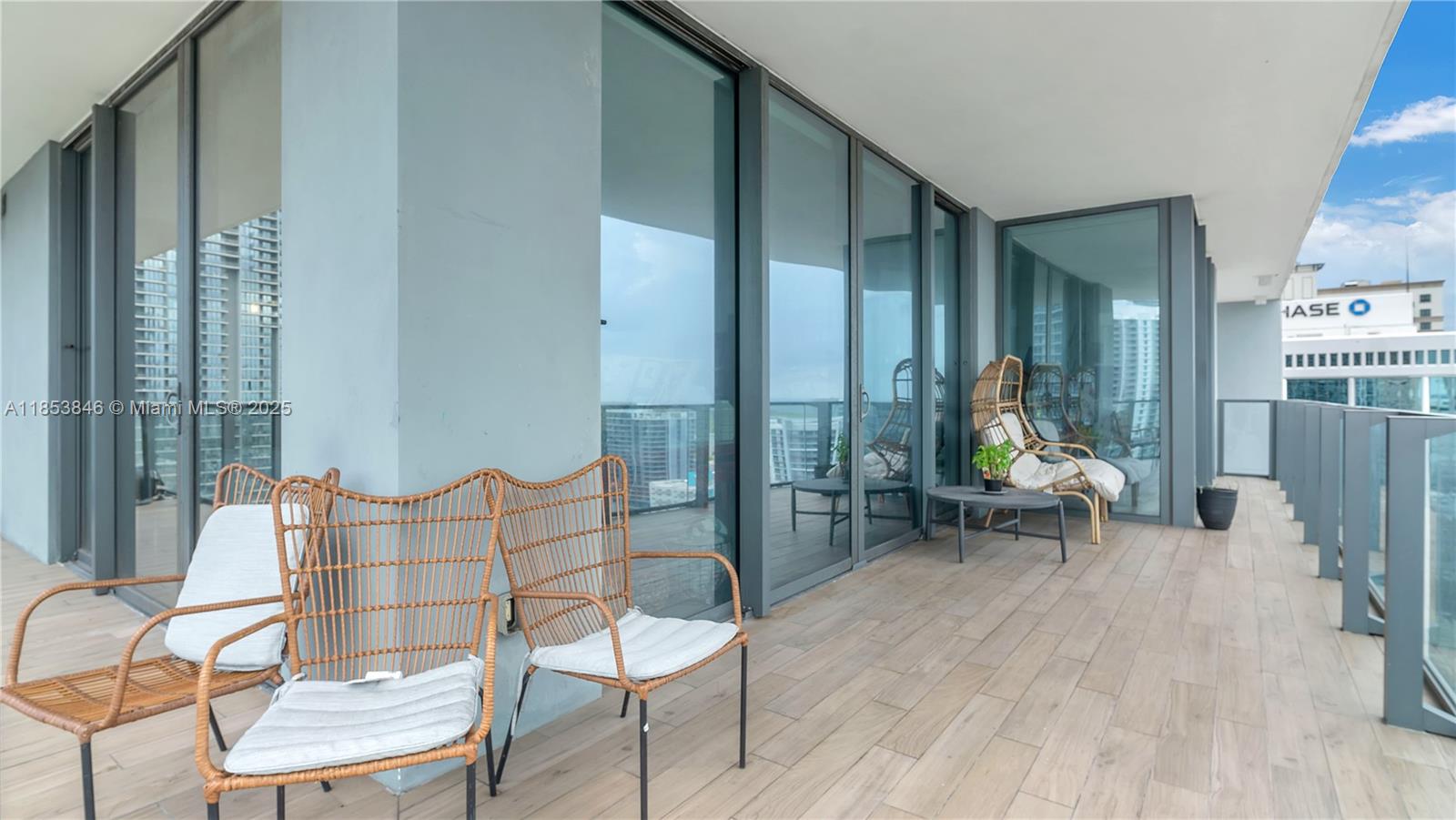 88 Southwest 7th Street, Unit 2312 Miami, FL 33130 - Photo 22 of 34 a view of a livingroom with lounge chair and a large window