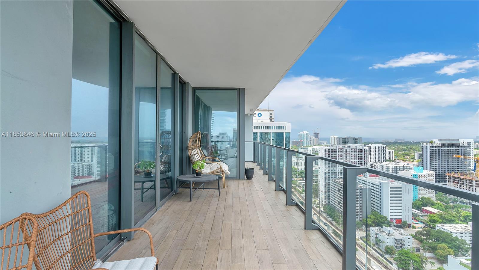 88 Southwest 7th Street, Unit 2312 Miami, FL 33130 - Photo 23 of 34 a balcony with wooden floor