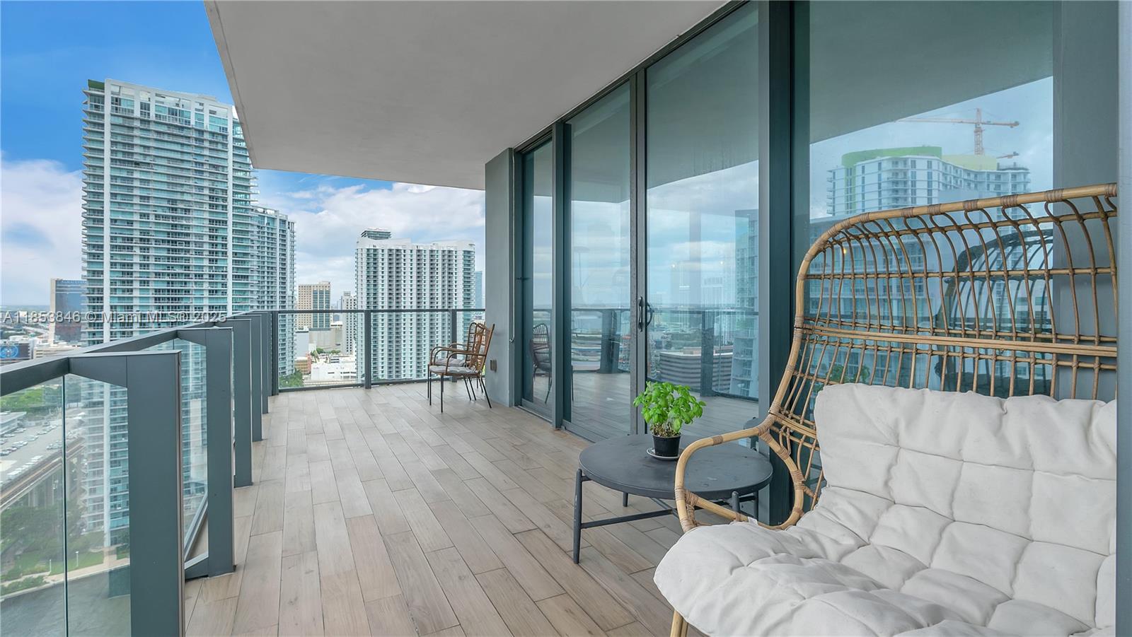 88 Southwest 7th Street, Unit 2312 Miami, FL 33130 - Photo 24 of 34 a living room with furniture and a floor to ceiling window