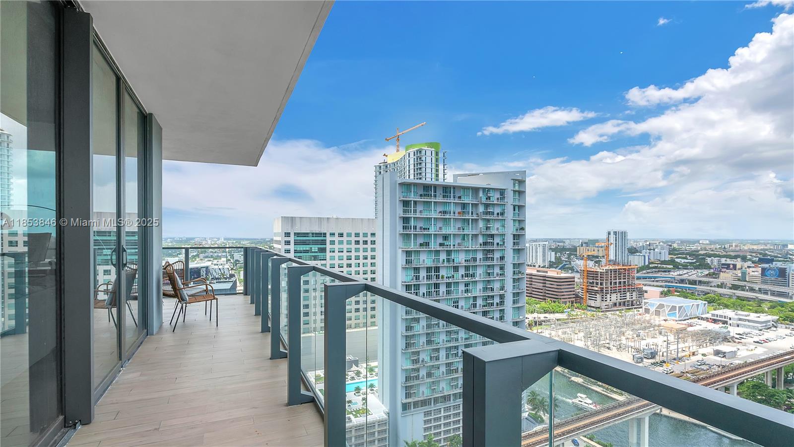 88 Southwest 7th Street, Unit 2312 Miami, FL 33130 - Photo 27 of 34 a city view from a balcony