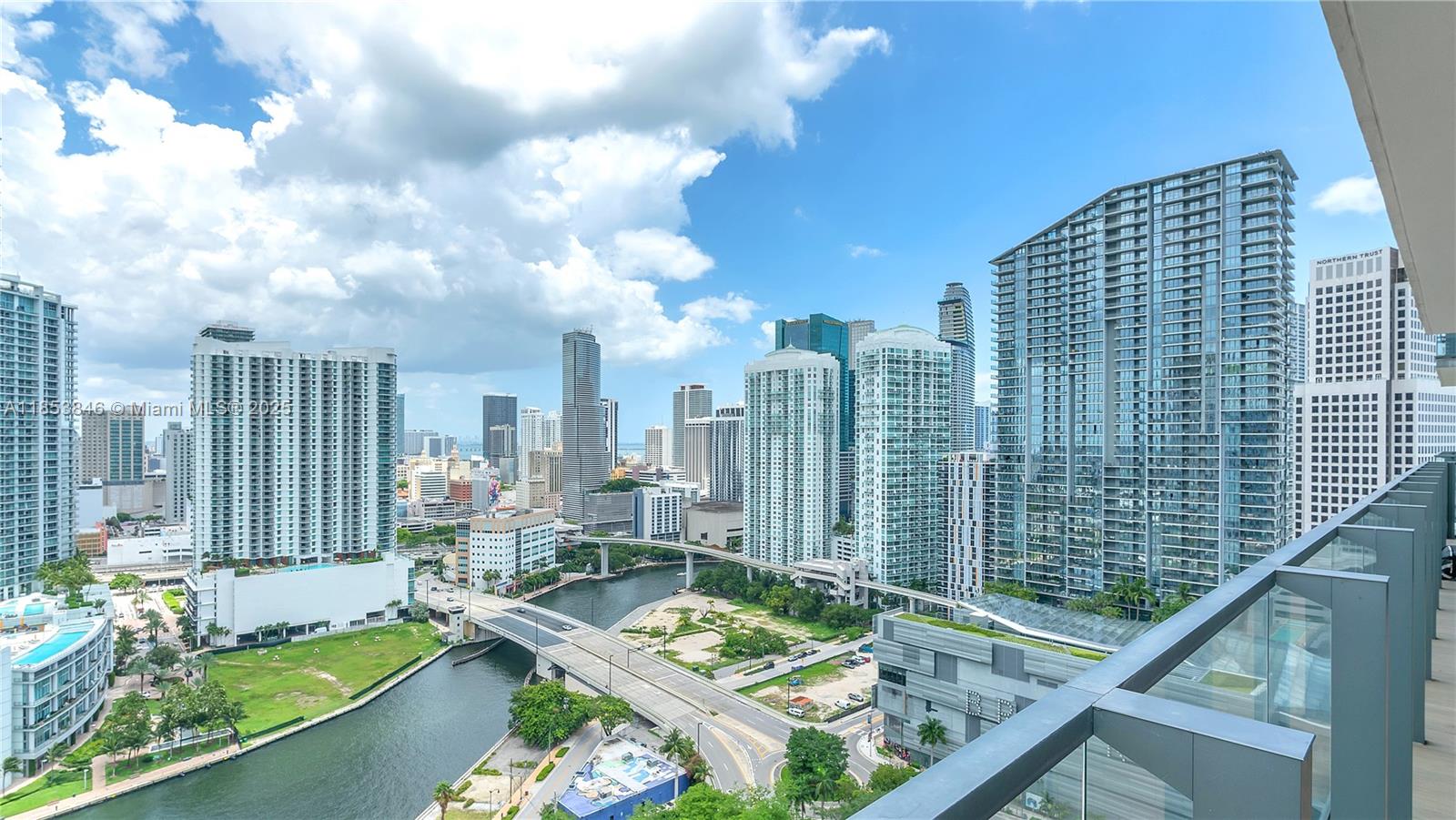 88 Southwest 7th Street, Unit 2312 Miami, FL 33130 - Photo 3 of 34 a view of swimming pool from a balcony