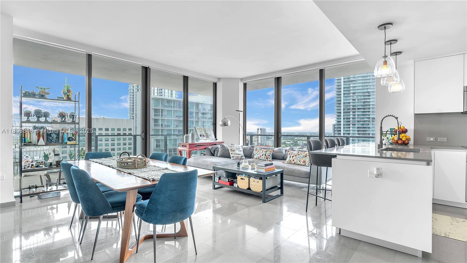 88 Southwest 7th Street, Unit 2312 Miami, FL 33130 - Photo 7 of 34 a living room with furniture and floor to ceiling windows
