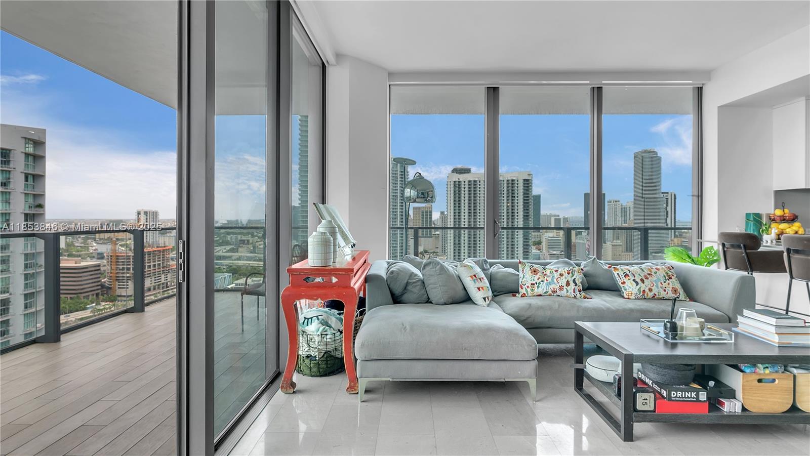 88 Southwest 7th Street, Unit 2312 Miami, FL 33130 - Photo 9 of 34 a living room with furniture and a floor to ceiling window