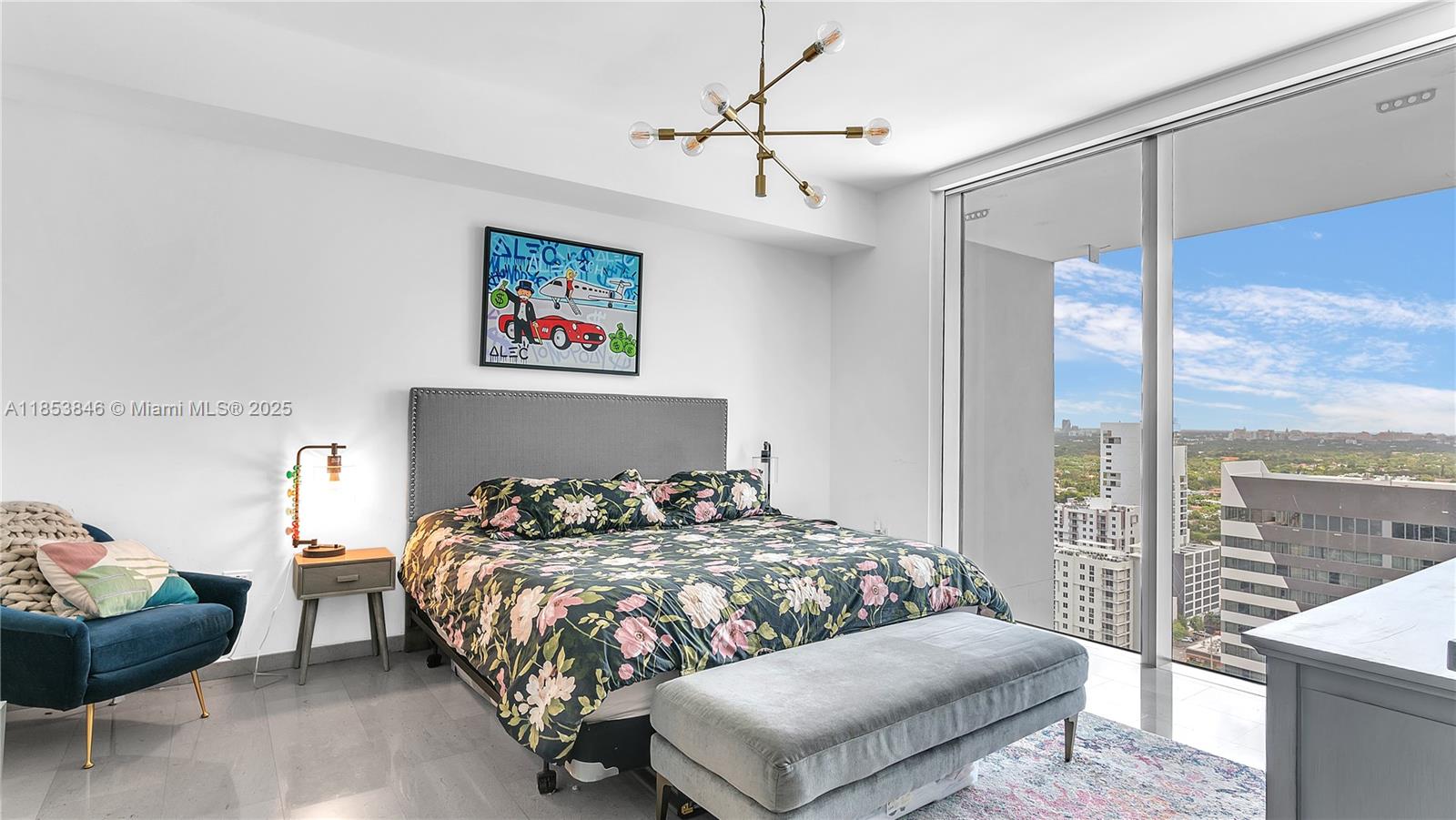 88 Southwest 7th Street, Unit 2312 Miami, FL 33130 - Photo 10 of 34 a bedroom with a bed and a couch