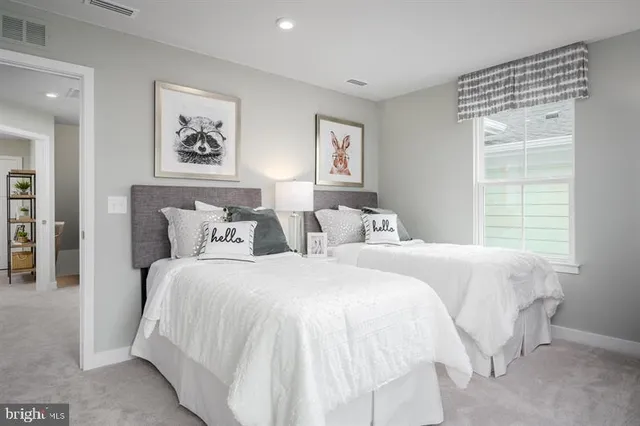 a bedroom with bed and a window