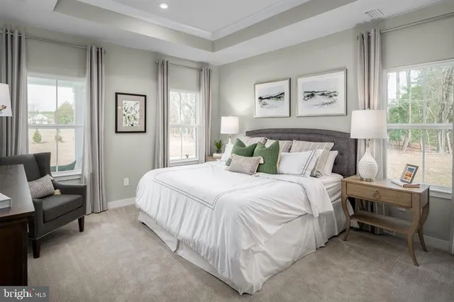 a bedroom with a bed and a couch