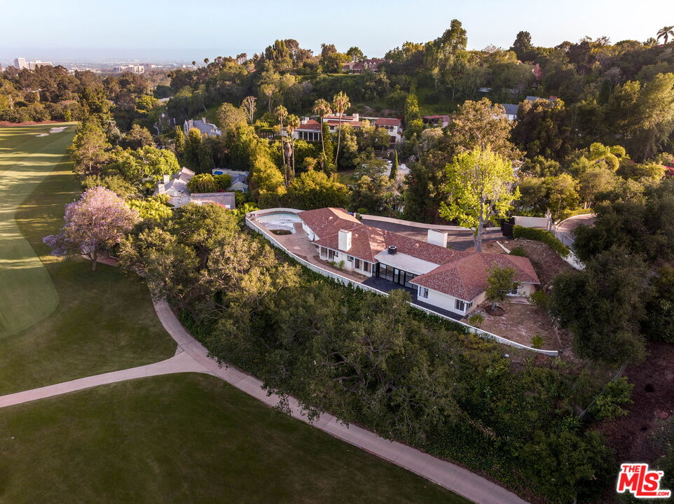 10985 Bellagio Road Los Angeles, CA 90077 - Photo 2 of 5 an aerial view of residential houses with outdoor space and trees