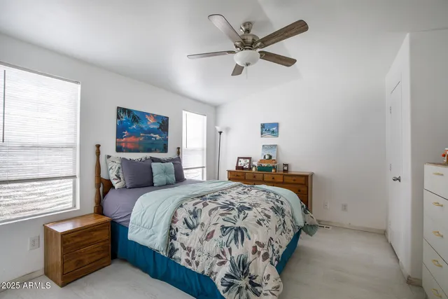 a bed room with a bed and a chandelier