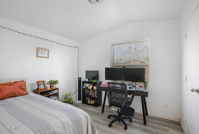 a bedroom with a workspace