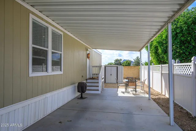 a backyard of a house with outdoor seating
